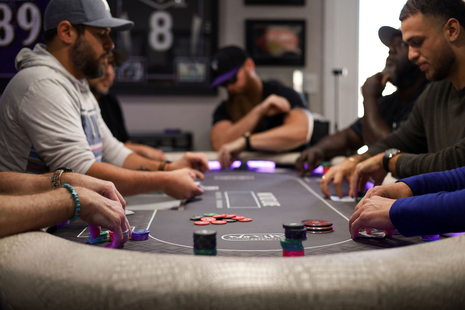 A high-end poker table set up for a home game tournament night.